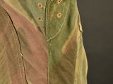 a close up of a military jacket with a hood on