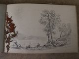 a book with a drawing of a landscape in it