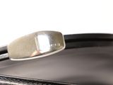 a close up of a black purse with a silver clasp