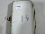 a small white box with a sticker on it
