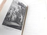 an open book with a picture of a woman and two children