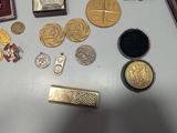 a lot of gold and silver items on a table