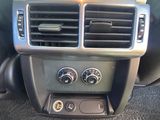 a car dashboard with the controls on and the air conditioning system