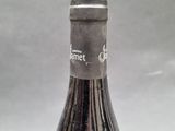 a bottle of wine that is sitting on a table
