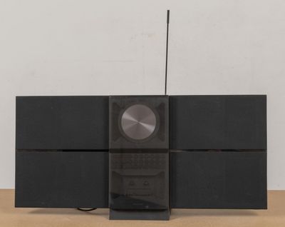 an image of a black stereo system on a wooden table