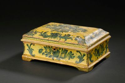 yellow and green painted box with flowers and vines on it