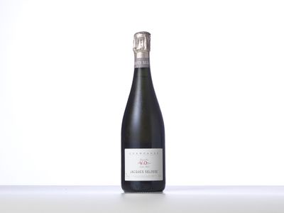 the bottle of wine is sitting on the table with a white background