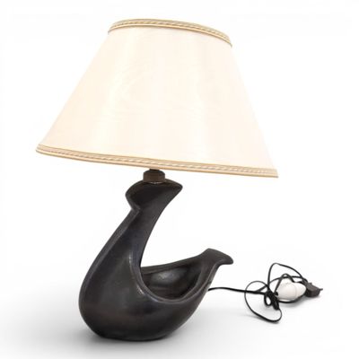 a black lamp with a white shade on it