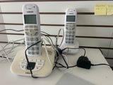 two phones that are sitting on a table