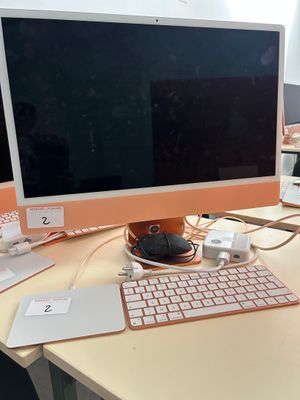a computer on a desk with a keyboard and mouse