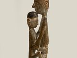 an image of a statue of a man holding a child