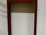 a small wooden box with a mirror on top of it