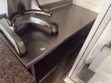 a dirty sink in the corner of a kitchen