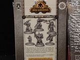 a box of miniature figurines that are sitting on a table