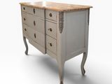 a white chest of drawers with a wooden top and legs