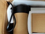 a box with a cup and a phone inside of it