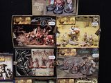 a lot of action figures on display on a black background