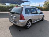 a silver car that is parked in a parking lot