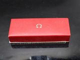 an open red box sitting on top of a black table