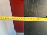 a measuring tape that is on the side of a door