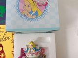 a box with a tea cup and a teapot in it