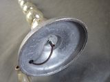 a metal object with a smiley face on top of it