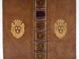 a brown book with a gold emblem on it