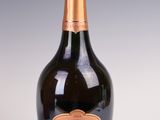 an image of a bottle of champagne on a white surface