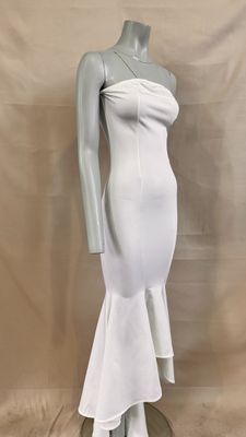 the mannequin is wearing a white dress on a mannequin stand