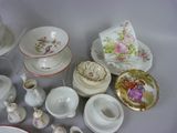 many different types of dishes and cups on the table