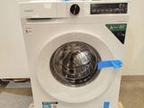 an image of a washing machine sitting on top of a wooden pallet