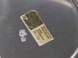 a piece of paper that has been placed on a metal plate