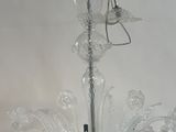 a glass chandelier hanging from the ceiling in a room