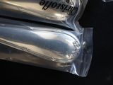 two bags of toothpaste sitting on top of each other