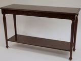 a wooden table with a shelf underneath it on a white background