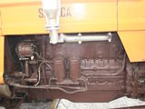 a close up of the engine of a train on the tracks