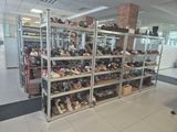 a room filled with lots of shoes on the shelves