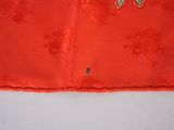 an image of a close up of a piece of cloth with a butterfly on it
