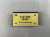 a gold and black badge with a name on it