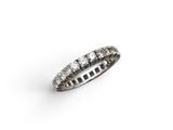 a close up of a diamond ring on a white background