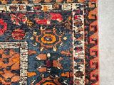 an old rug with many different colors and patterns on it