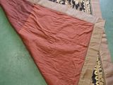 an image of a piece of cloth laying on top of a green floor