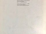 the back cover of a book with a black and white image of a cat