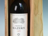 a bottle of red wine in a wooden box