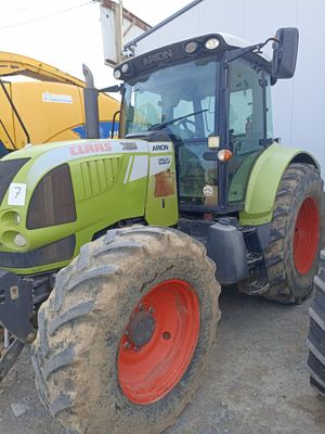 a tractor that is parked next to a building
