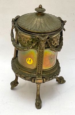 a small brass box with a lid on a stand