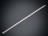 un bracelet en diamants, signé Cartier