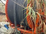 a hose that is sitting in the middle of a field