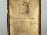 un tableau ancien encadré représentant une femme tenant un livre