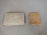 a small box and a small book on a table